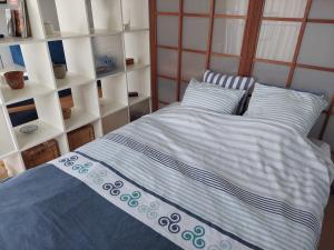 Postel nebo postele na pokoji v ubytování Studio lumineux proche port & plages