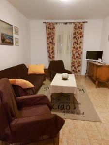 a living room with a couch and a table at Apartment Nataša- Apt.1 in Trogir