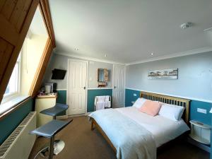 Кровать или кровати в номере Bayliss Hall Guesthouse