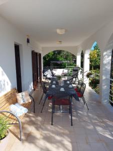 a patio with a table and chairs on a porch at Apartment Nataša- Apt.1 in Trogir