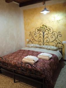 Ένα ή περισσότερα κρεβάτια σε δωμάτιο στο Il Piccolo Granaio