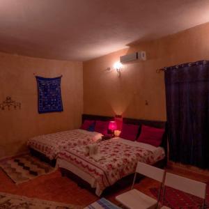 Postel nebo postele na pokoji v ubytování Maison Riad Tamarighte