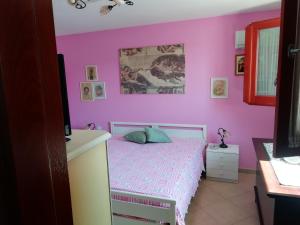 Cama o camas de una habitación en Specchia Terrazza&Tavernetta Arcobaleno