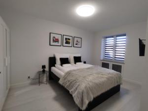 Posteľ alebo postele v izbe v ubytovaní Apartament Wrocław Borowska