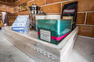 a counter with boxes and other items on it at Luxury Warwick Townhouse I Walk to Castle I Dog friendly I Private patio garden I in Warwick +23 photos