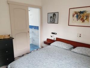 Postel nebo postele na pokoji v ubytování Appartamento turistico Sunset Home + 19 fotografií