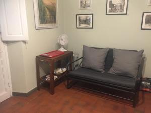 a living room with a couch and a table at LA BARRIERA UNO in Florence