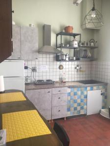 a kitchen with a tiled counter top in a kitchen at LA BARRIERA UNO in Florence