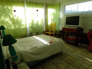 En eller flere senge i et værelse på Cabañas Cafayate II