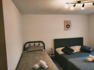 a bedroom with two beds in a room at Apartments Zaton Draga in Zaton +123 photos