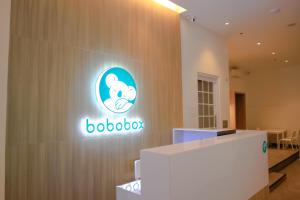 a sign on the wall of a room with a boobot logo at Bobopod Mega Mall, Bekasi in Pekayon Satu