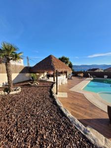 a resort with a swimming pool and a resort at Casa A Boleriña 2 in Combarro