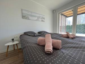 En eller flere senge i et værelse på Beach Promenade