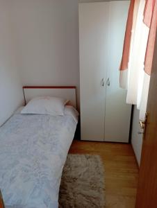 Postel nebo postele na pokoji v ubytování Apartments Šime