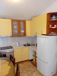 Kuchyň nebo kuchyňský kout v ubytování Apartments Šime