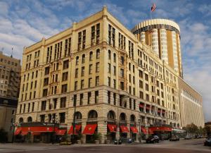 a large building with a flag on top of it at The Pfister Hotel in Milwaukee