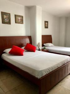 Uma cama ou camas num quarto em Hotel Onix Gold