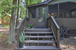 a tiny house with stairs leading to the front door at 2 Bedroom Cabin Inside Glacier National Park in West Glacier