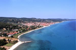 an aerial view of a beach with a town at Akrogiali Exclusive Hotel (Adults Only) in Polykhrono