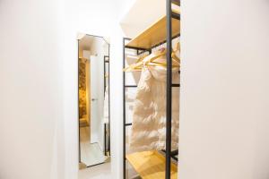 a room with a closet with a dress in it at ENTREARCOS in Cádiz +35 photos