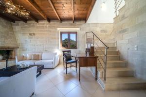 A seating area at FOS residence - ΦΩΣ ,luxury villa