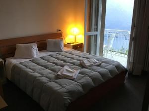 Postel nebo postele na pokoji v ubytování Hotel Mirabeau + 37 fotografií