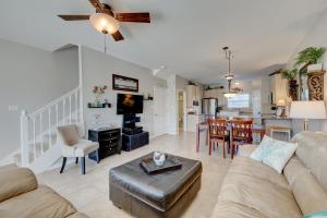 a living room with a couch and a table at Beach Blessings Luxe 30A Townhome 2BR 3Bath, Walk to Beach, Pool, Hot Tub in Santa Rosa Beach