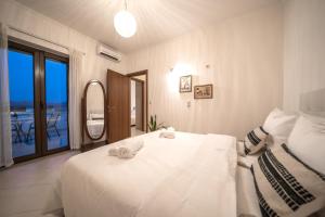 A bed or beds in a room at FOS residence - ΦΩΣ ,luxury villa