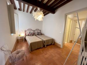 Letto o letti in una camera di San Giorgio Suite