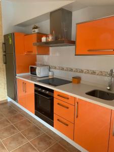 A kitchen or kitchenette at Alojamientos A Pedra