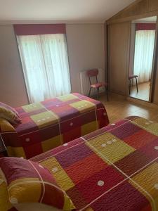 A bed or beds in a room at Alojamientos A Pedra