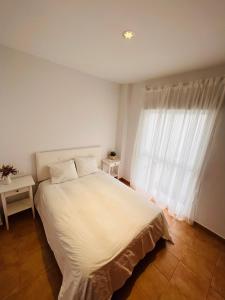 Postel nebo postele na pokoji v ubytování Apartamento Vega Conil