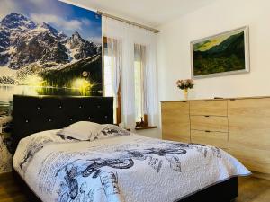 Posteľ alebo postele v izbe v ubytovaní Apartament Rodzinny Gubałówka