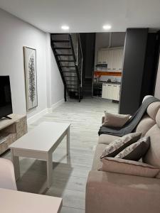 a living room with a couch and a table at TEMPLE LOFT in Talavera de la Reina