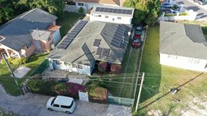 an aerial view of a house with solar panels on the roof at Elegant Marble Suite #6 in Nassau