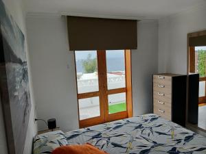 a bedroom with a bed and a window at Morro Mar in Morro del Jable