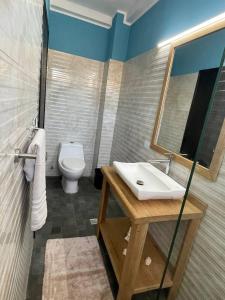 a bathroom with a sink and a toilet at Posada Paraiso in El Yaque +23 photos