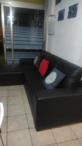 Posedenie v ubytovaní Ático Arinaga con vistas , jacuzzi , terraza y barbacoa