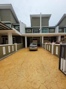 a car parked in the driveway of a house at Teduhan Abqory in Kuala Terengganu