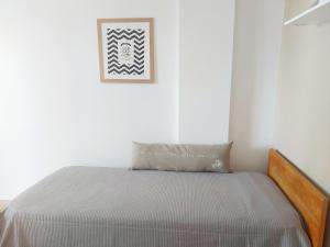 Una cama o camas en una habitación de Moderno y luminoso departamento en Rosario