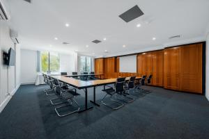 a conference room with a long table and chairs at The Select Inn Penrith in Penrith