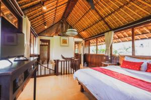 Postel nebo postele na pokoji v ubytování Bebek Cottages Sanur