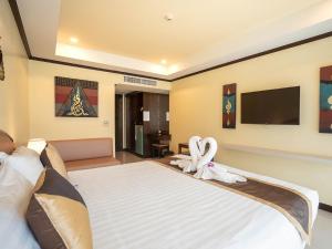 Postel nebo postele na pokoji v ubytování Baan Sailom Hotel Phuket - Sha Extra Plus