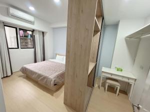 Postel nebo postele na pokoji v ubytování 依金那海景民宿