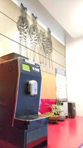 a cash register in a room with skeletons on the wall at Golden Park Hotel in Jeju