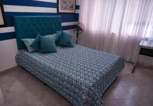 Postel nebo postele na pokoji v ubytování Casa La Palma Habitación Cielo