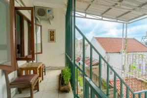 a balcony with a view of a building at Omah Gerjen 29 by Bukit Vista in Yogyakarta