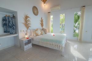 A bed or beds in a room at Salt Resort & Spa