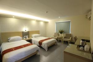 Postel nebo postele na pokoji v ubytování Guang Dong Hotel + 37 fotografií