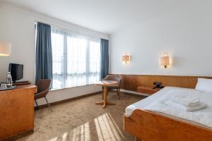 Postel nebo postele na pokoji v ubytování Trip Inn Klee am Park Wiesbaden